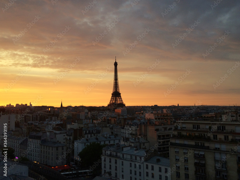 Paris skyline with an impressive Eiffel Tower in the sunrise.