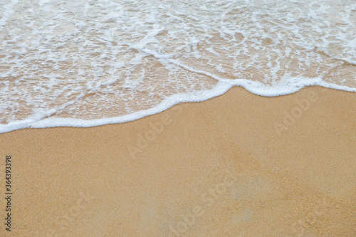 Beautiful clean sand beach with white wave, summer nature background, outdoor day light