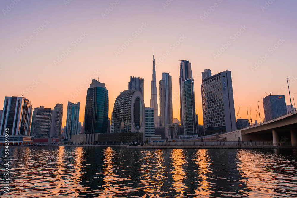 Dubai downtown skyline at sunset. Futuristic  city panoramic view. 