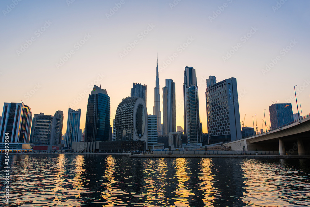 Dubai downtown skyline at sunset. Futuristic  city panoramic view. 