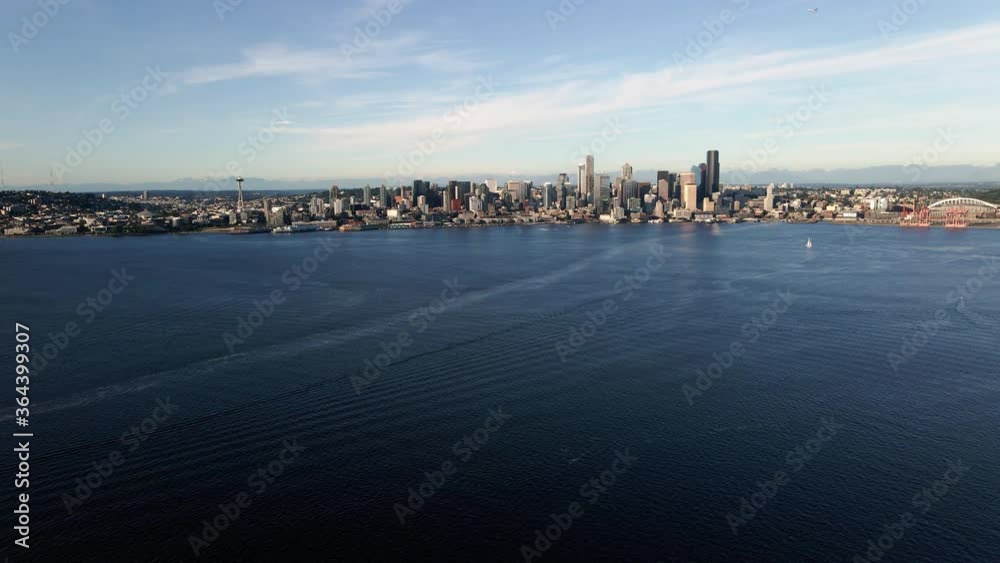 Amazing Seattle Waterfront Skyline Aerial Over Blue Puget Sound Ocean Water Amazing Seattle Waterfront Skyline Aerial Over Blue Puget Sound Ocean Water
