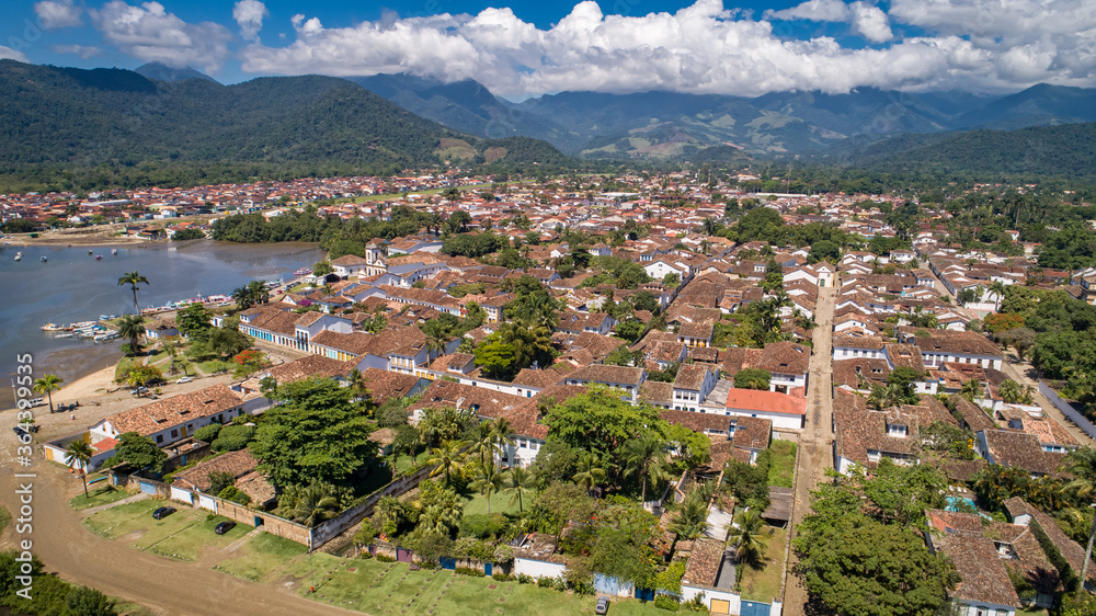 Aerial view to historic town Paraty and harbour, green mountains in background, sunny day, Unesco World Heritage, Brazil