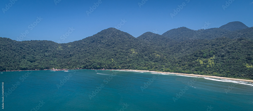 Panoramic aerial view to wonderful Green Coast shoreline and mountains covered with Atlantic Forest, Picinguaba, Brazil
