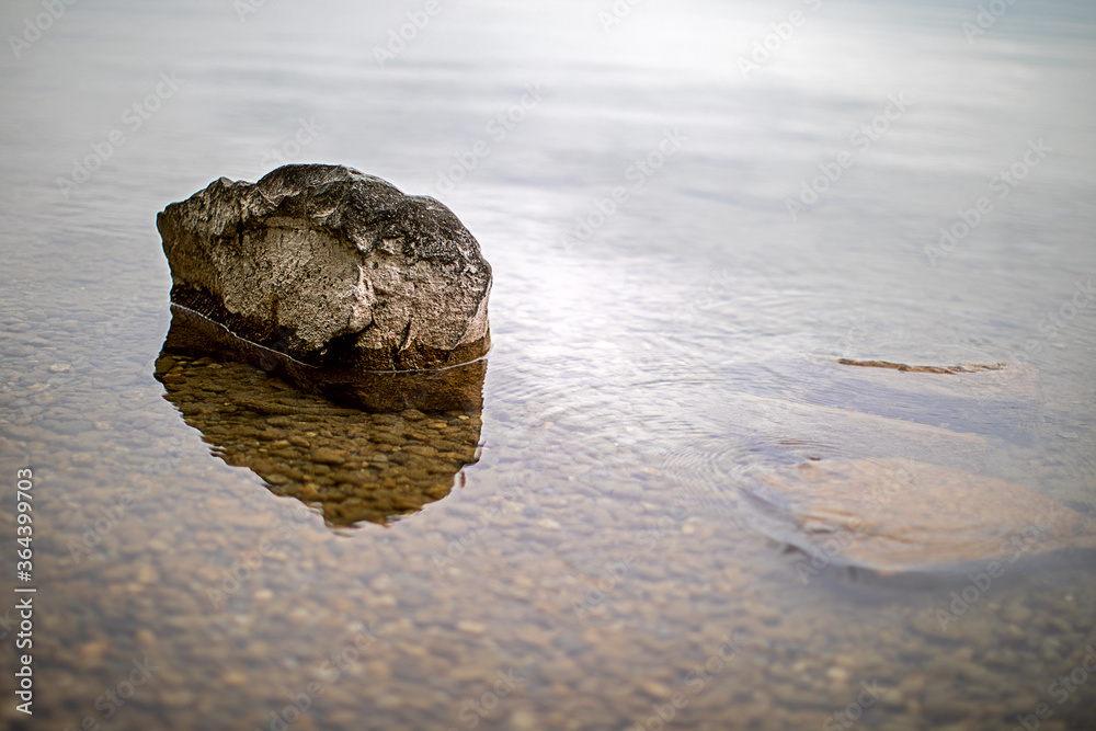 .stones in the water on the bank of a lake .stones in the water on the bank of a lake