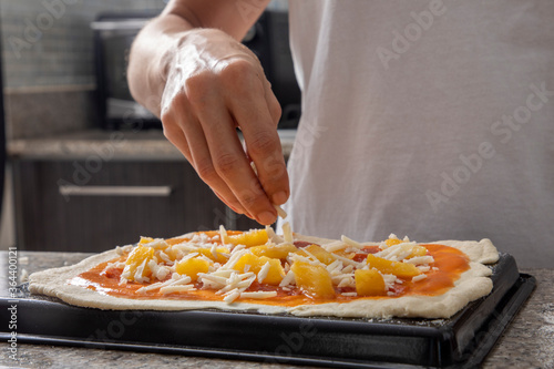 woman hands preparing pizza close-up