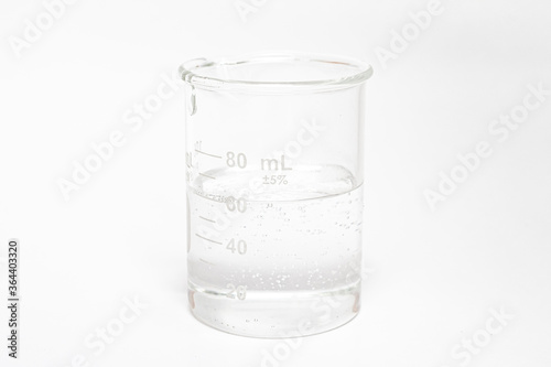 experiment liquid in beaker with scale on white background
