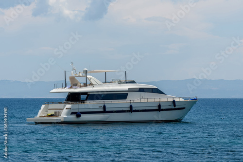 Huge luxury motor yacht cruising in a calm ocean © byrdyak