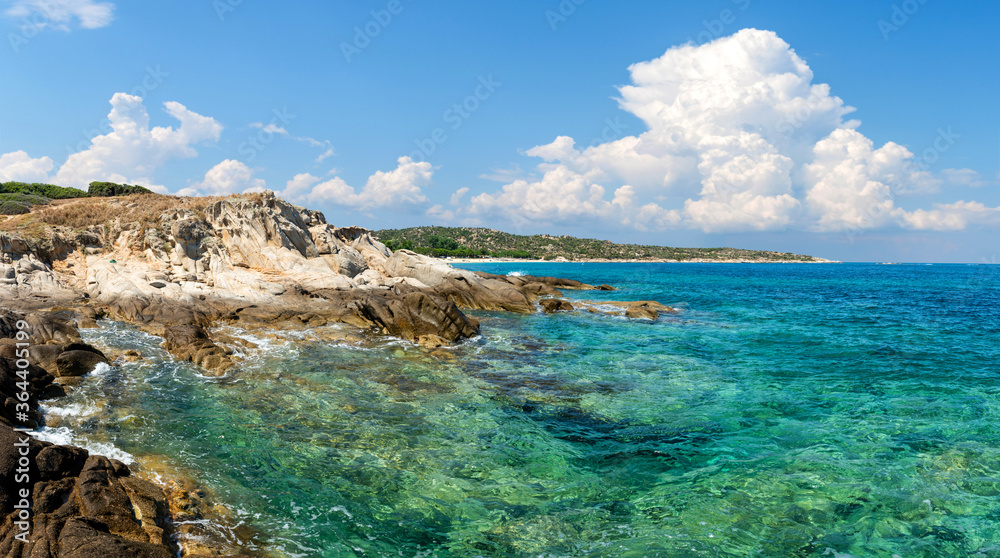Landscape with sea, the rock and the beautiful clouds in the blue sky