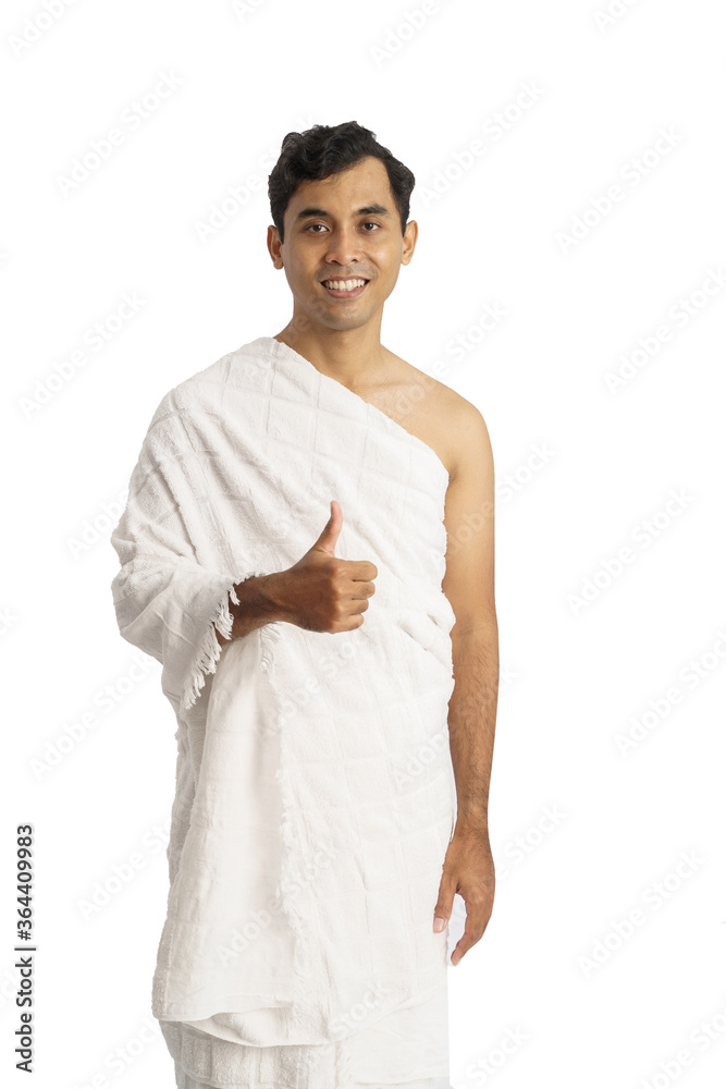 muslim pilgrims man with ihram clothes show thumb up. man hajj traveling muslim pilgrims man with ihram clothes show thumb up. man hajj traveling