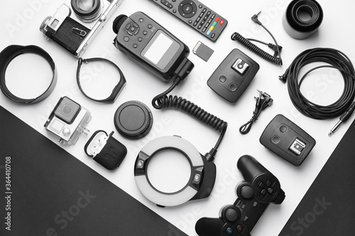 Different modern devices on black and white background