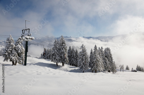 Ski lift on Rotenflue, Ibergeregg, on a beautiful winter day in central Switzerland