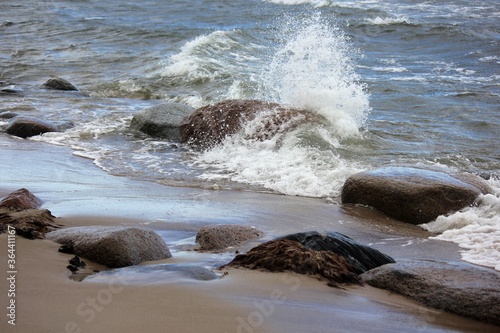 Waves crashing the rocks on the beach