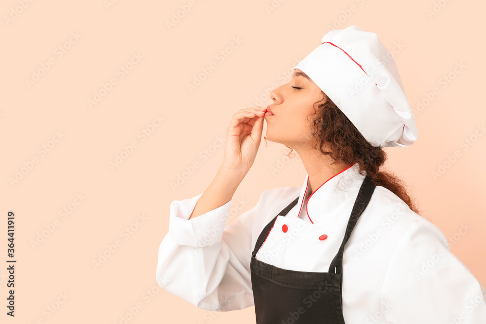 Female African-American chef on color background Female African-American chef on color background