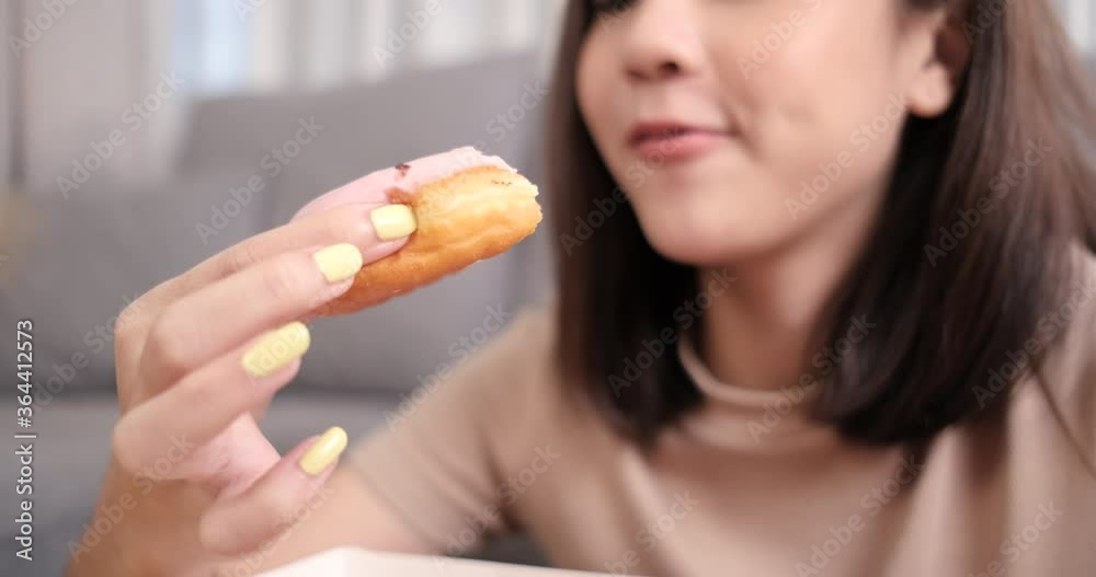 Close up asian woman takeaway eating donut sweet junk food delivery. Close up asian woman takeaway eating donut sweet junk food delivery.