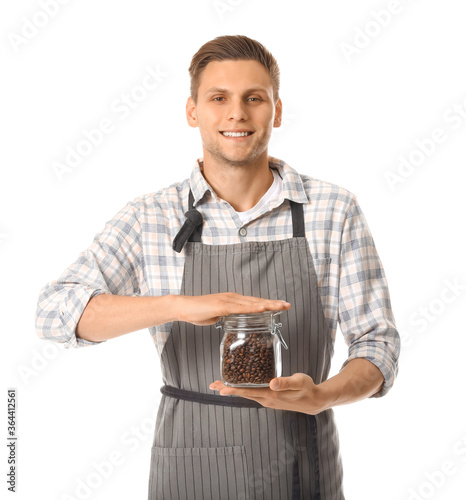 Young male barista on white...