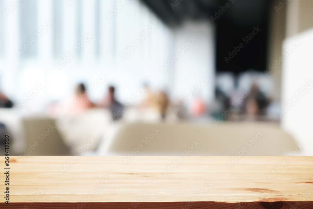 Empty wooden desk space and blurry background of cafe or Restaurant for product display montage. Empty wooden desk space and blurry background of cafe or Restaurant for product display montage.