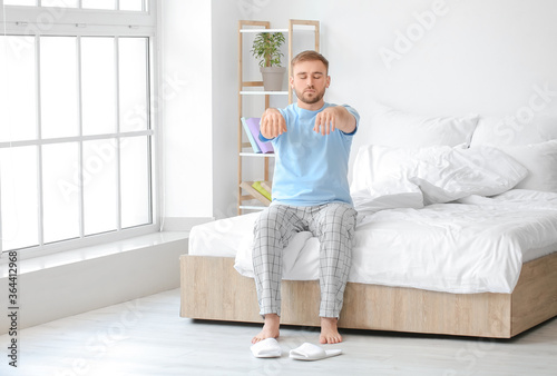 Male sleepwalker in his bedroom