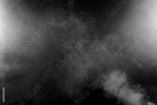 White smoke on a black background. The texture of scattered smoke. Blank for design. Layout for collages.