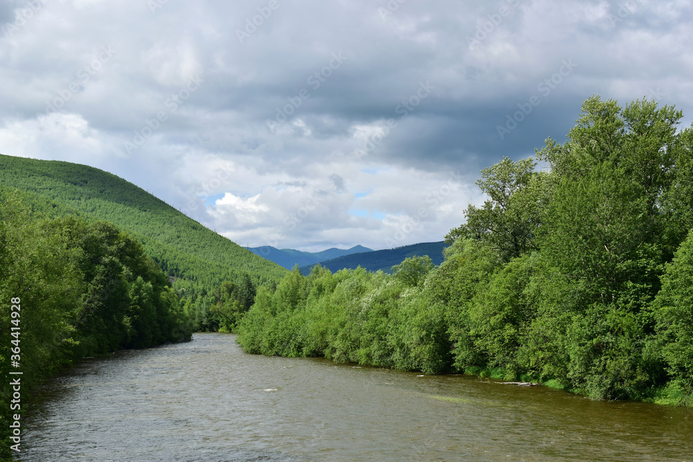 Taiga river among blue-green mountains. Sikhote-Alin.
