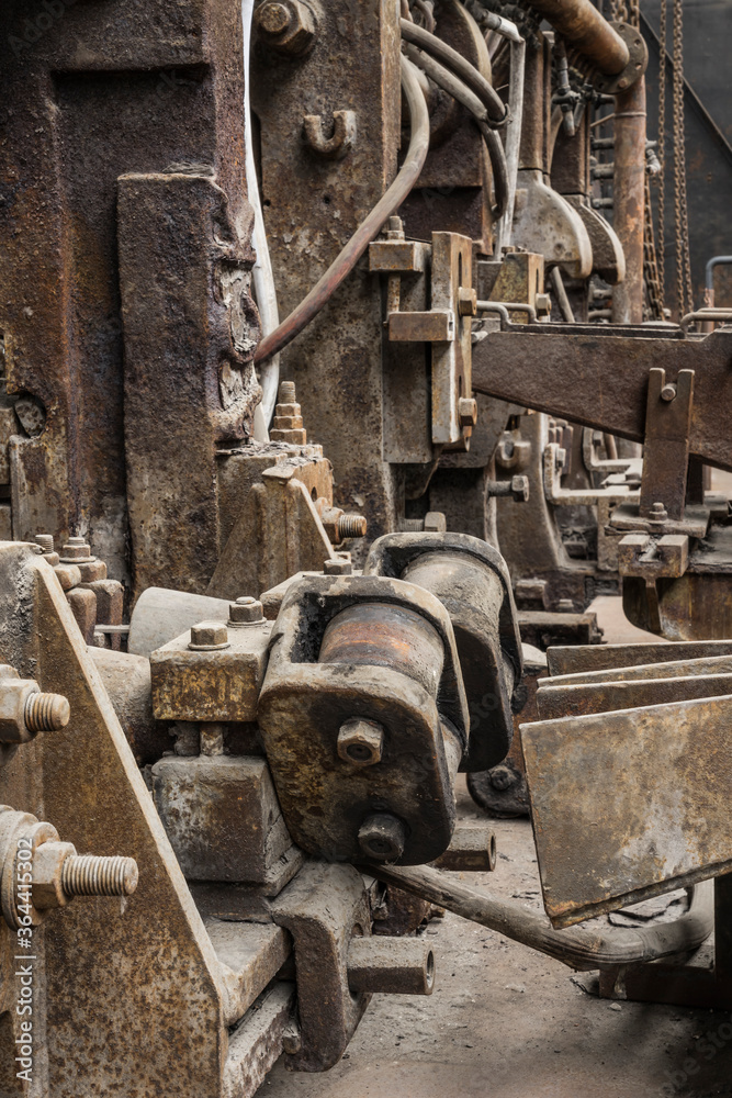 Old rusty steel rolling machinery.