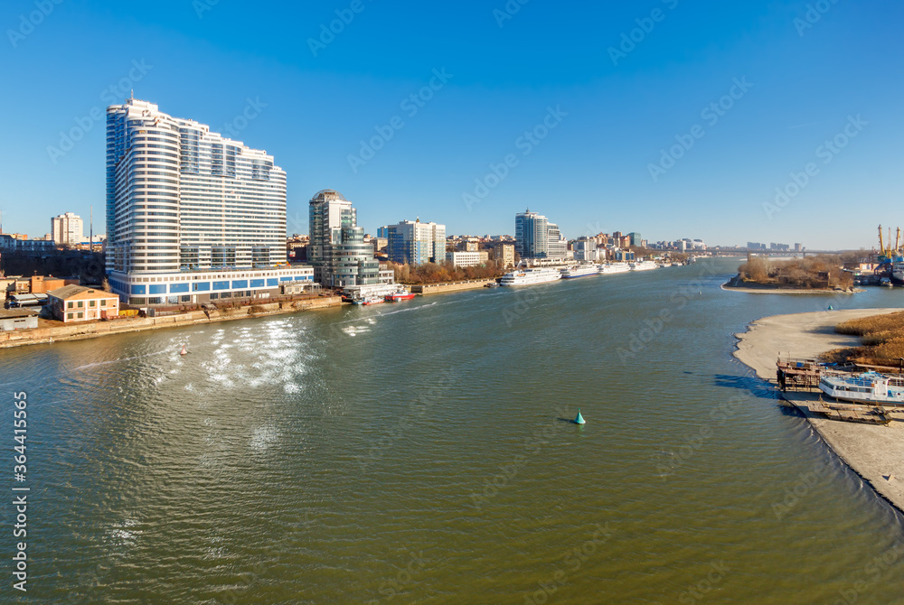 The Don river in late autumn time with big city buildings on the bank. Rostov-on-Don, Russia