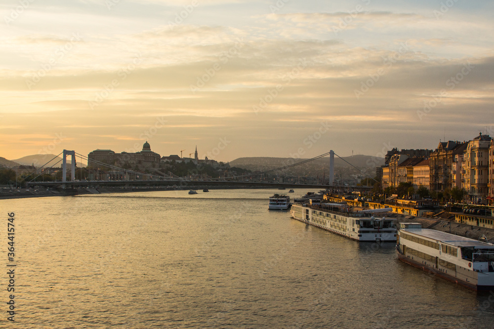 View of the Danube river embankment in Budapest at sunset. Hungary