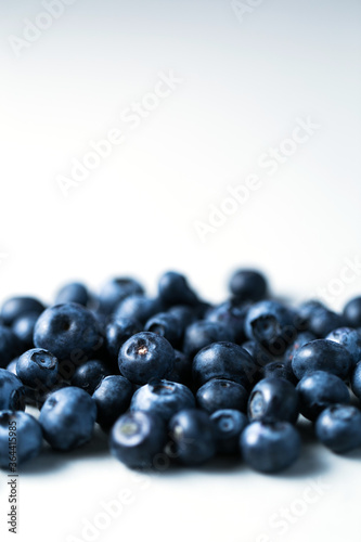Beautiful blueberry close up background with deep shadows © Olena Kovalova