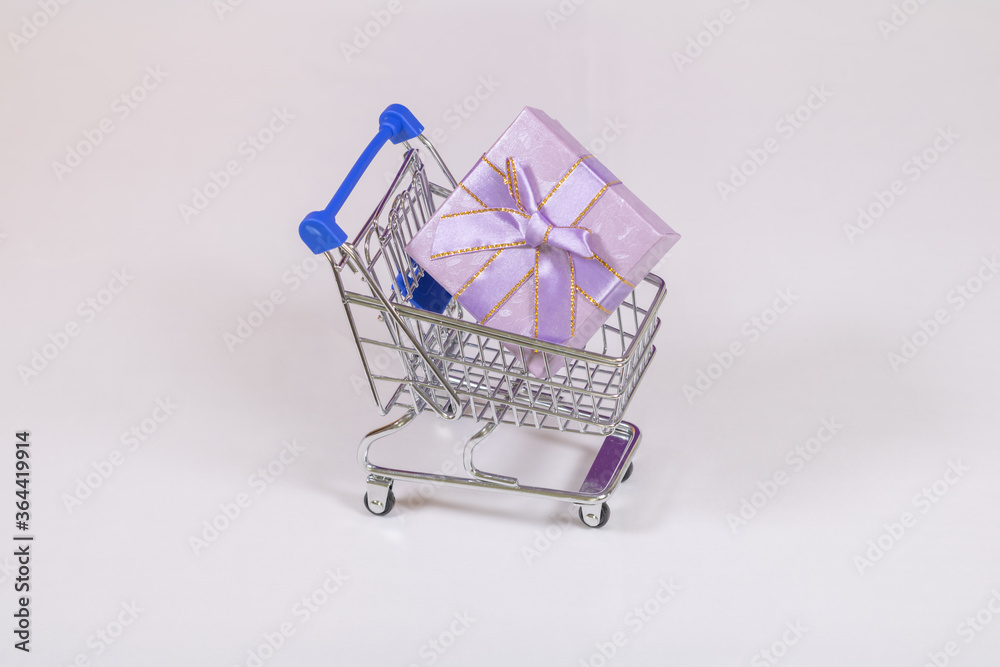 Shopping carts with gifts inside on a white background. Shopping carts with gifts inside on a white background.