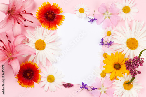 Garden flowers frame over pink