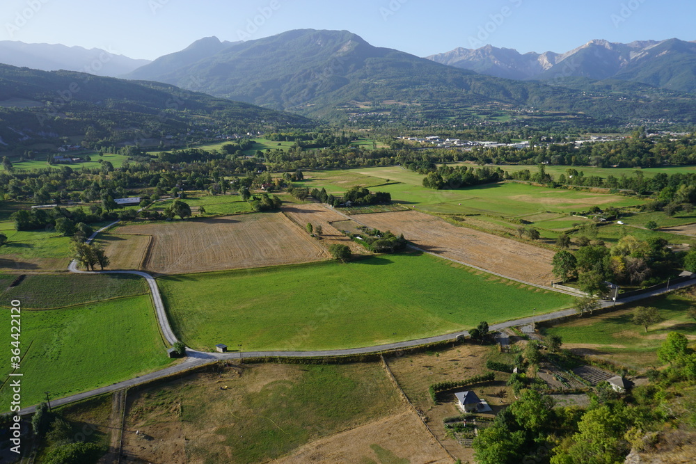 panoramic view of the french Alps and fields from the town of Embrun