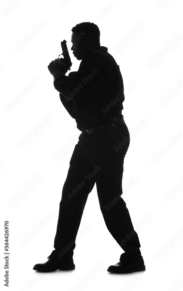 Silhouette of aggressive African-American police officer with gun on white background