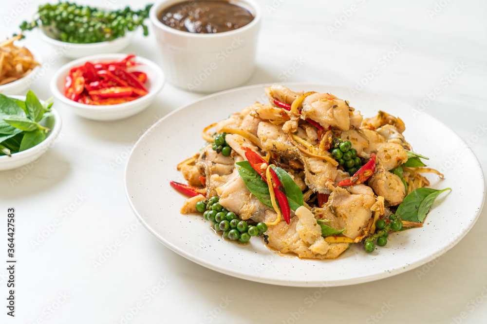 stir fried holy basil with fish and herb