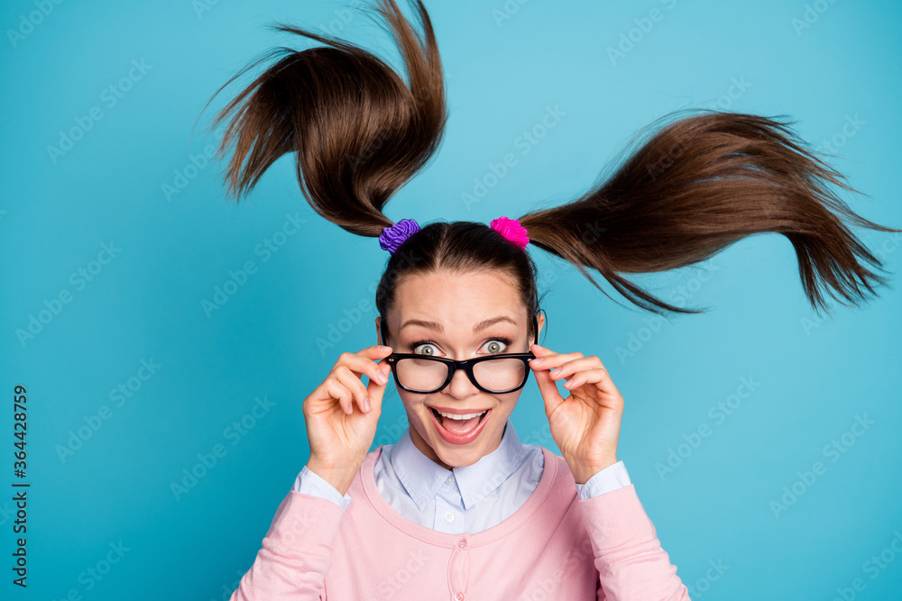 Portrait of crazy funny funky high school girl student touch spectacles  impressed incredible lesson lecture schedule wear pastel clothes hair fly  isolated blue color background Stock Photo | Adobe Stock