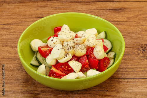 Salad with vegetables and mozzarlla photo