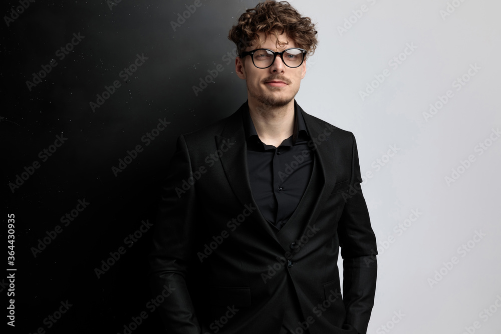 handsome businessman with attitude, standing and posing handsome businessman with attitude, standing and posing