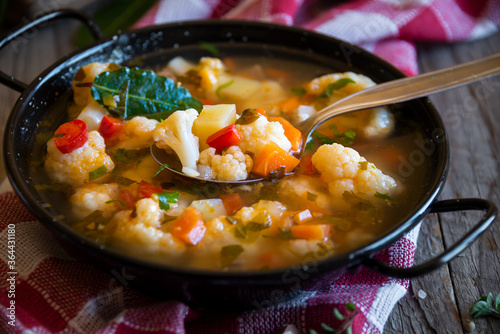 Vegetable soup with cauliflower, laurel and other vegetables