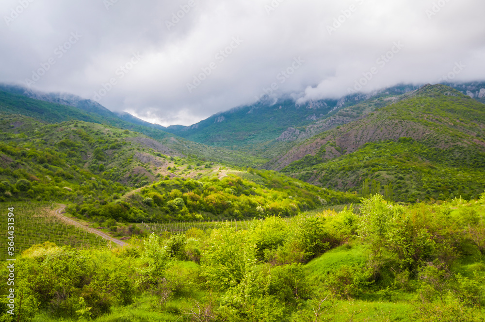 Picturesque view, rain clouds in mountains Picturesque view, rain clouds in mountains