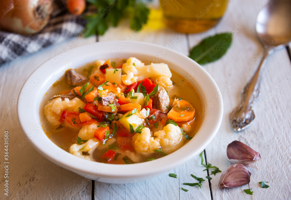 Vegetable soup with cauliflower, laurel and other vegetables Vegetable soup with cauliflower, laurel and other vegetables