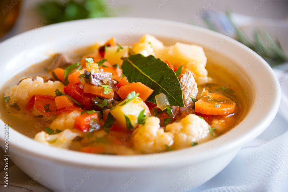 Vegetable soup with cauliflower, laurel and other vegetables Vegetable soup with cauliflower, laurel and other vegetables