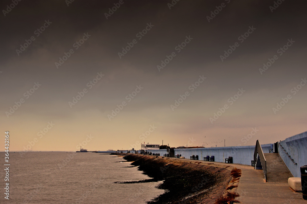 Benches by the sea wall at Concord beach Canvey Island, Essex, England