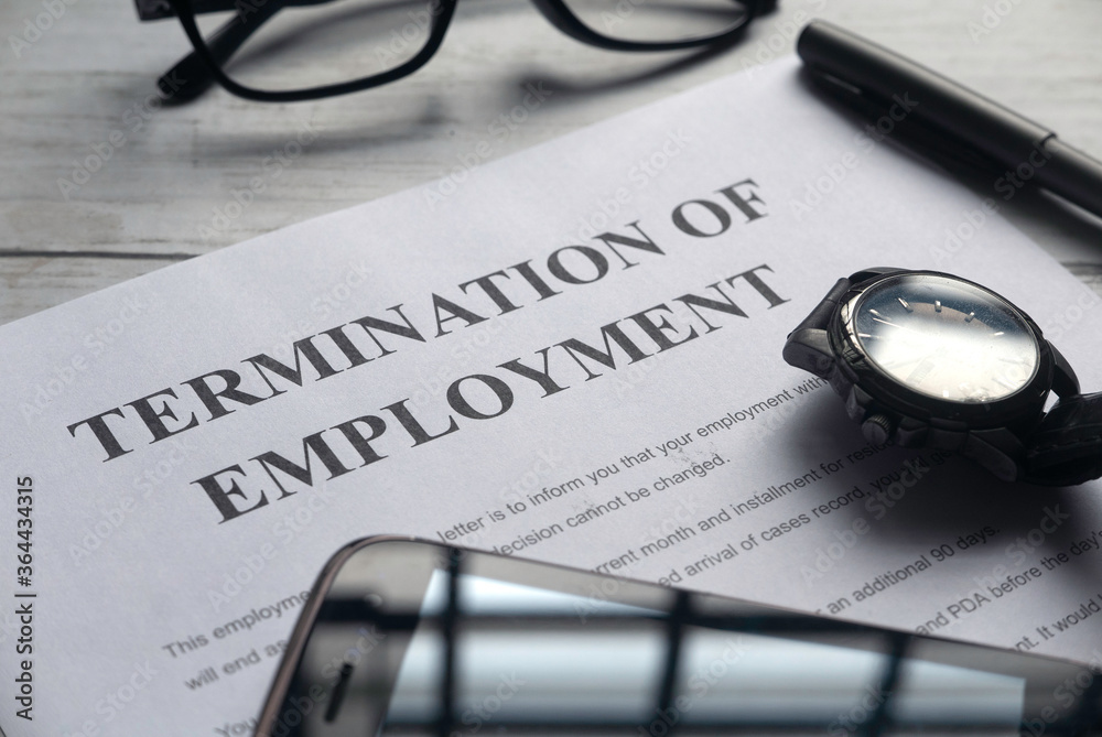 Εκτύπωση καμβά Selective focus of watch,mobile phone,pen,glasses and Termination of Employment letter on a white wooden background
