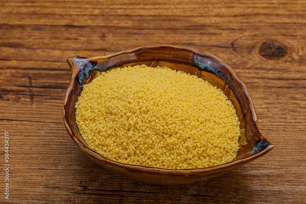 Raw cous cous heap in the bowl Raw cous cous heap in the bowl