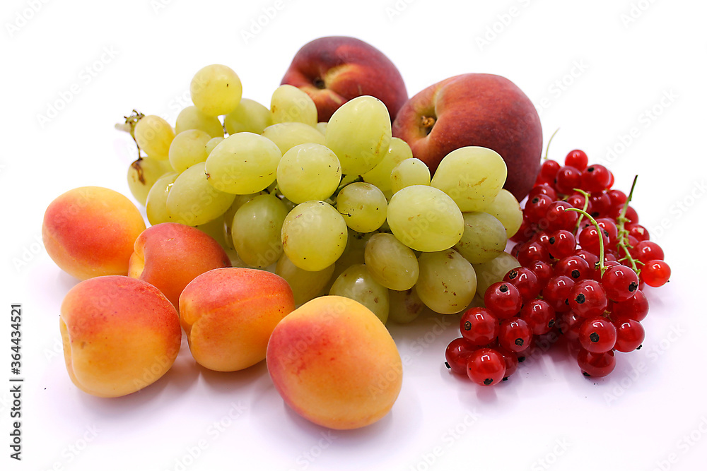 Grape bunch, peaches, red currants and apricot close-up on a white background Grape bunch, peaches, red currants and apricot close-up on a white background