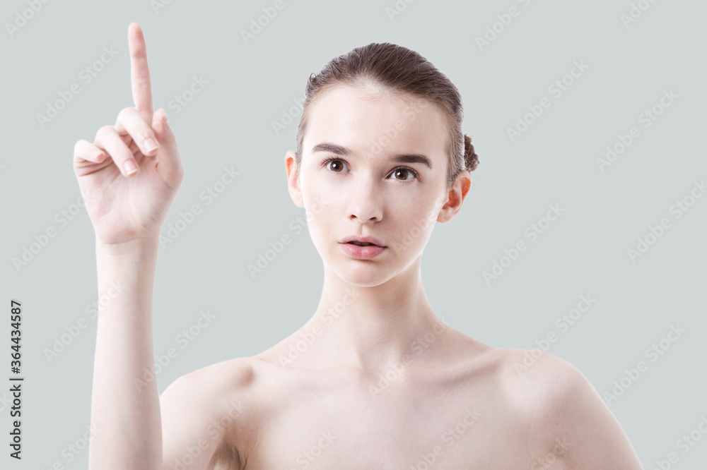 Caucasian woman holding finger in air Caucasian woman holding finger in air