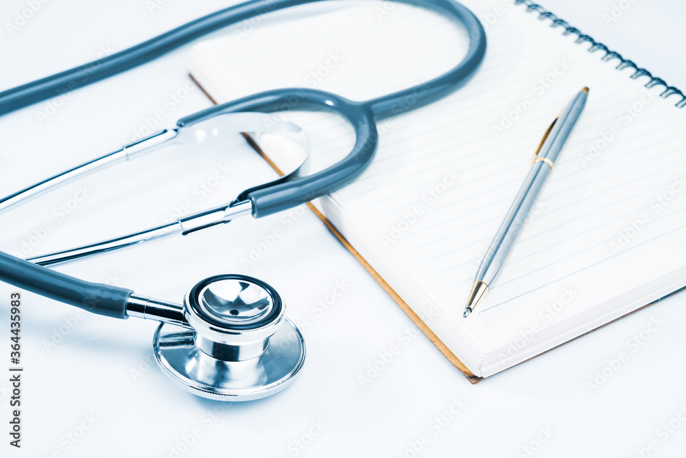 Medical stethoscope on blank notepad Medical stethoscope on blank notepad