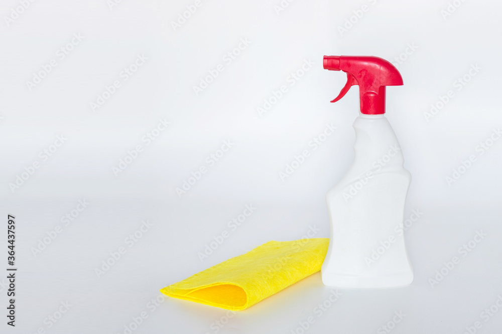 Plastic bottles with chemicals for home cleaning on a white background. Plastic bottles with chemicals for home cleaning on a white background.
