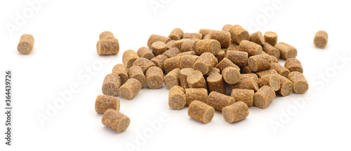 Pile of compound fish feed pellets.