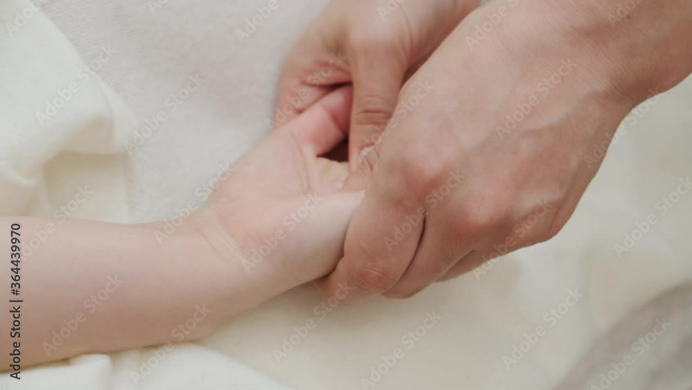 Female therapist massages young woman on hands, palms and fingers. Relaxing massage. Therapeutic massage. Alternative medicine. Spa treatments. Female therapist massages young woman on hands, palms and fingers. Relaxing massage. Therapeutic massage. Alternative medicine. Spa treatments.