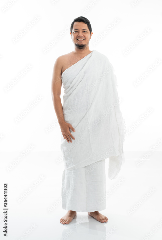 pose muslim asian man standing with tasbih while standing in white traditional clothes pose muslim asian man standing with tasbih while standing in white traditional clothes
