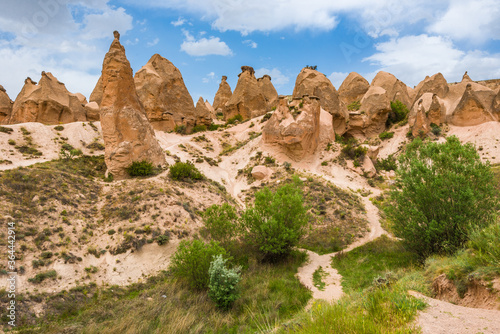A path leads through the unique landscape and fairy chimney rock formations in Devrent Valley, known also as Imagination Valley, near Goreme in Nevsehir Province, Cappadocia Turkey